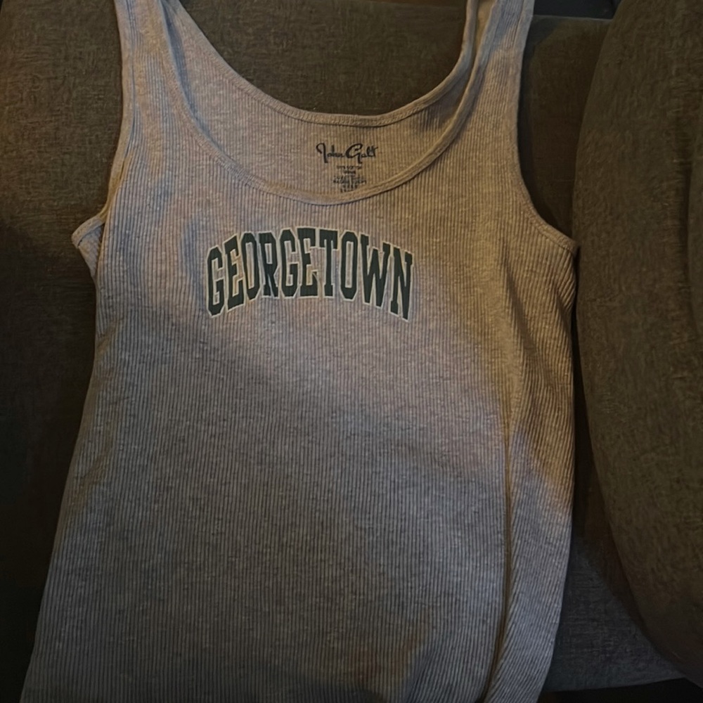 This tank top is a brandy Melville and is size small it is also the color grey